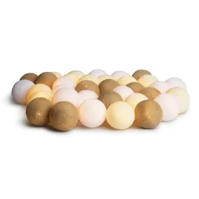Irislights Creamy White 20 bollar Beige från Irislights - Slingan &auml;r tillverkad i plast och har handtillverkade bollar i bomull och polyester som ger ett fint mjukt ljus n&auml;r den &auml;r t&auml;nd.