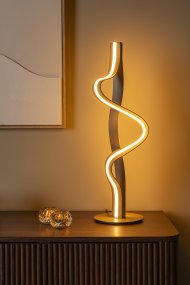 Lambada 60cm Champagne från Lucide - Lambada &auml;r en elegant bordslampa i metall med en exklusiv champagnef&auml;rgad finish och en mjukt organisk form som f&aring;ngar blicken.