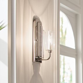 Kimrose 35cm Nickel vägglampa från Elstead Lighting - Dess geometriska former st&aring;r i fokus och f&ouml;rst&auml;rks av en elegant finish i polerad nickel.