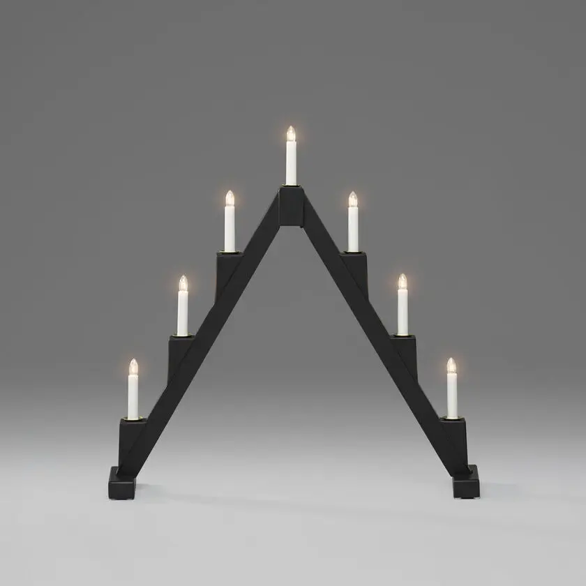 Elljusstake 7ljus vikbar Svart från Konstsmide - Vikbar elljusstake med 7 ljus, tillverkad av svartm&aring;lat tr&auml;, dekorerad med m&auml;ssingsringar runt varje ljus f&ouml;r en elegant touch.