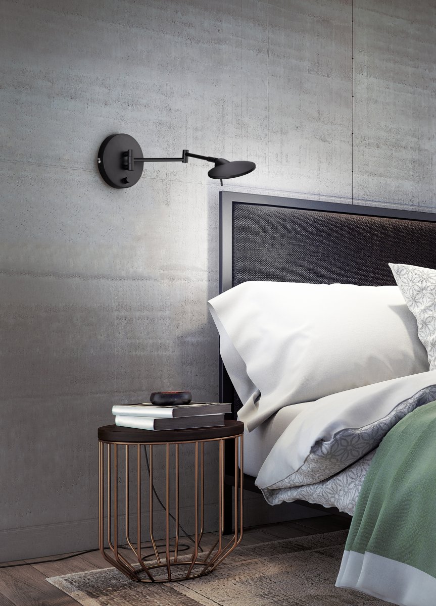 Kazan 55cm Svart vägglampa från Trio Lighting - En extra kabelutg&aring;ng p&aring; basen g&ouml;r att lampan kan installeras b&aring;de med fast anslutning och med sladd och stickkontakt.