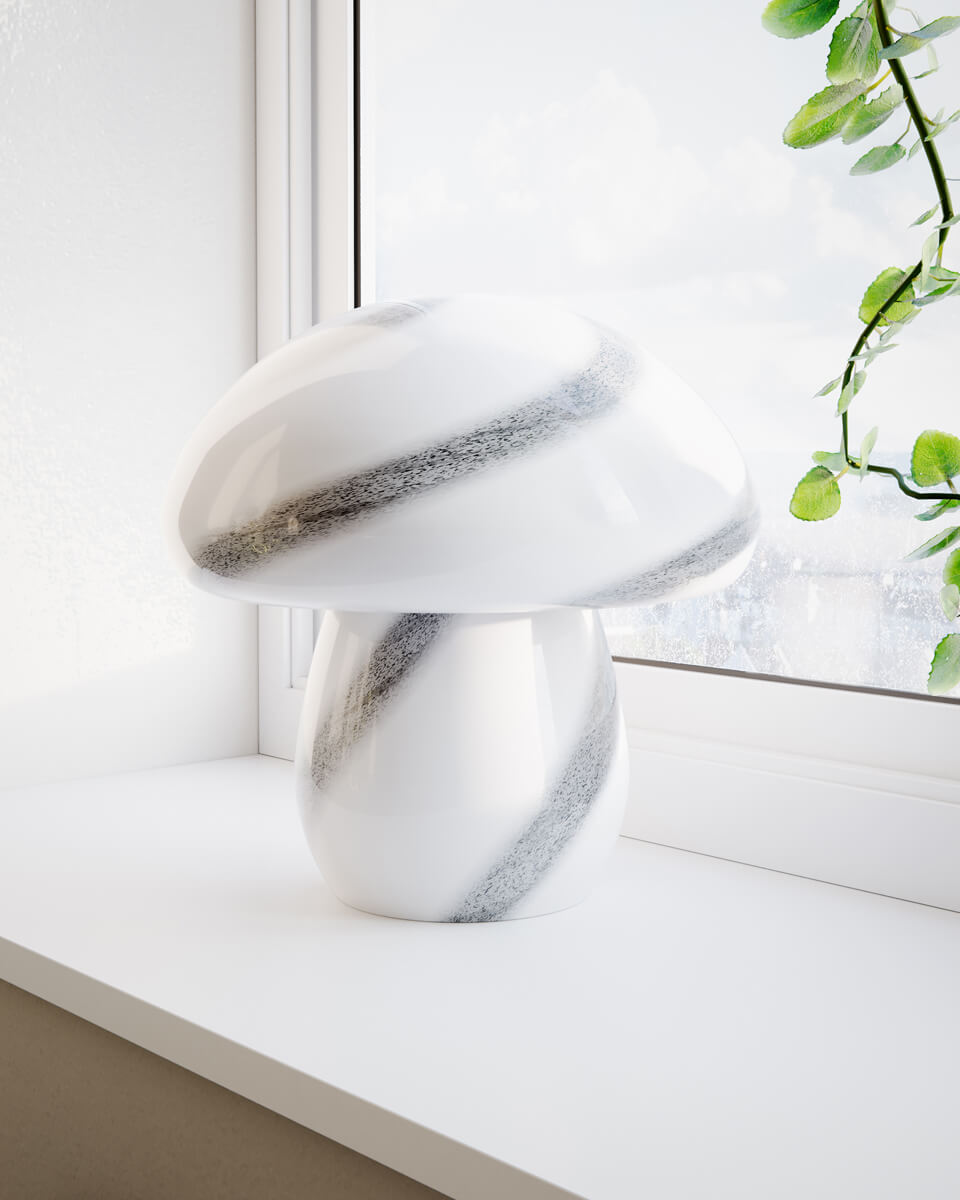 Mira Mushroom 30cm Vit/svart bordslampa från By Rydéns - Lampan &auml;r inte bara en funktionell ljusk&auml;lla utan ocks&aring; en konstn&auml;rlig detalj som lyfter fram din inredning med sin naturinspirerade design och handgjorda kvalitet.