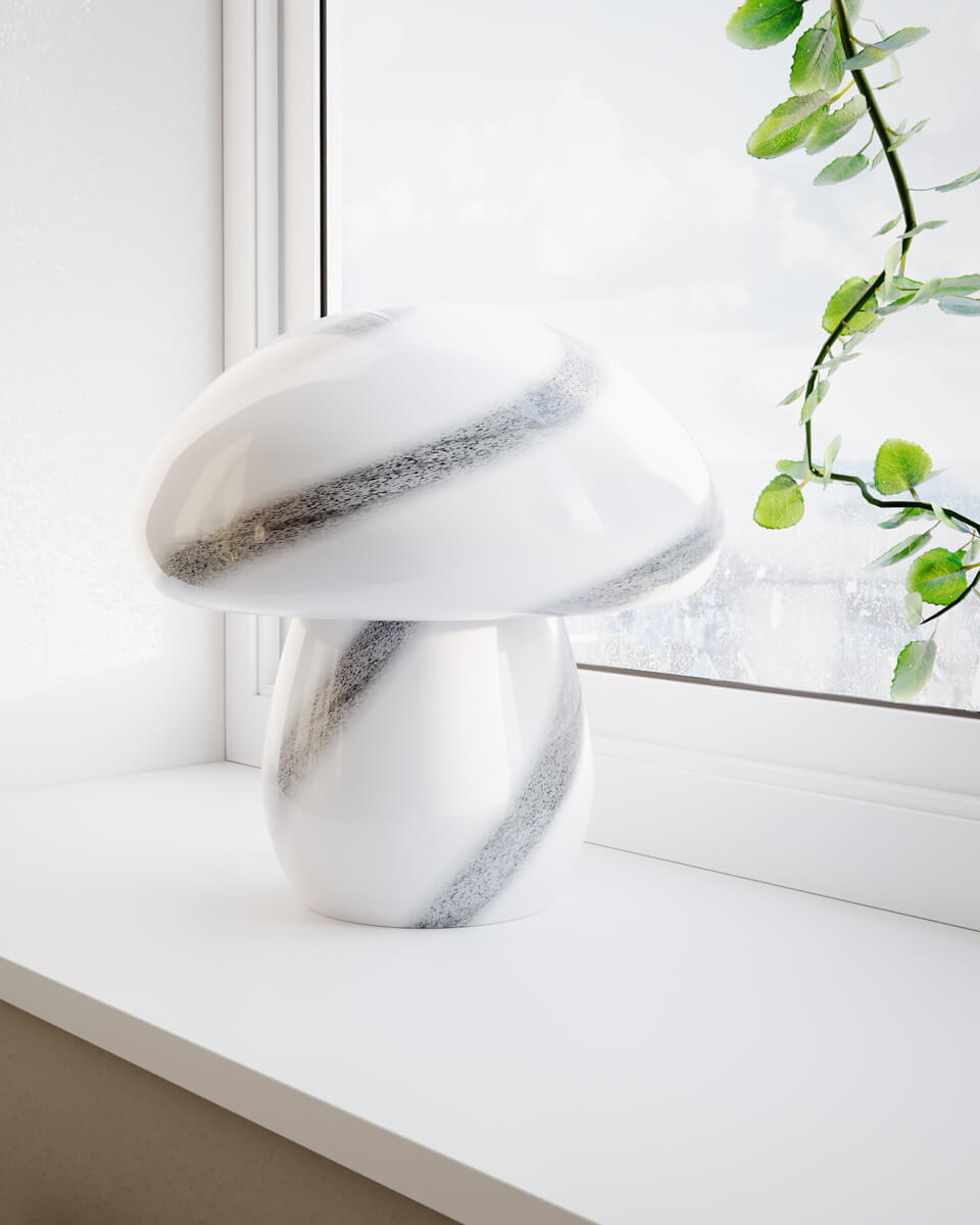 Mira Mushroom 30cm Vit/svart bordslampa från By Rydéns - Lampan &auml;r inte bara en funktionell ljusk&auml;lla utan ocks&aring; en konstn&auml;rlig detalj som lyfter fram din inredning med sin naturinspirerade design och handgjorda kvalitet.