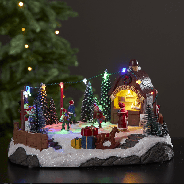 Iceville Flerfärgad från Star Trading - St&auml;mningsfull dekoration till jul eller advent med en liten skridskobana som roterar och spelar musik.