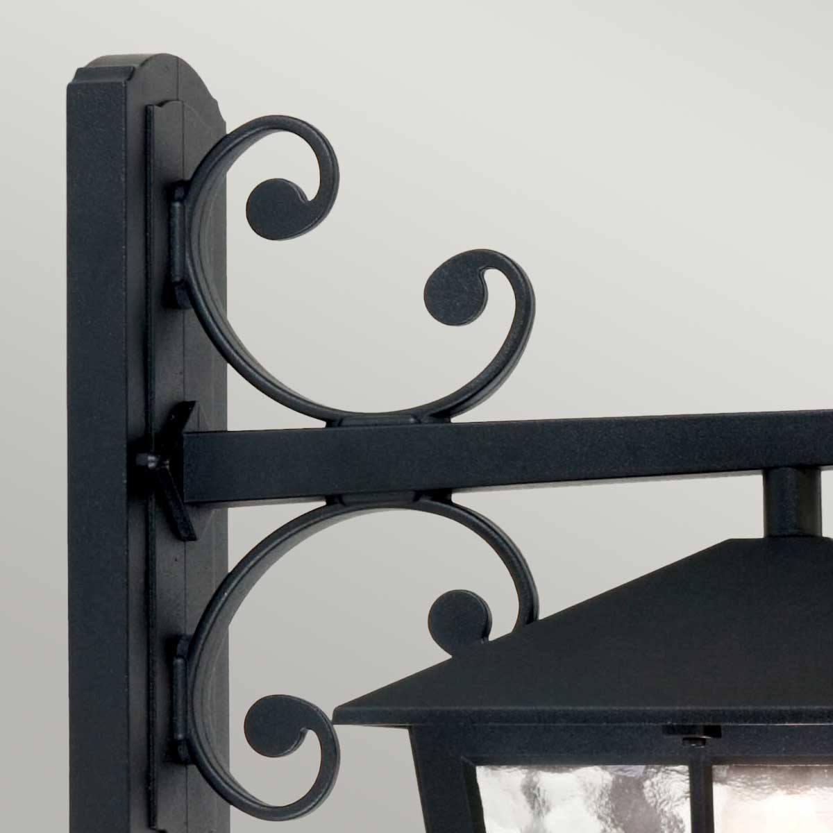 Canterbury Svart utelampa från Elstead Lighting - Canterbury v&auml;gglampa &auml;r en del av en serie mellanstora lyktor med en typiskt brittisk stil, med f&ouml;nsterb&aring;gar och eleganta kurvor.